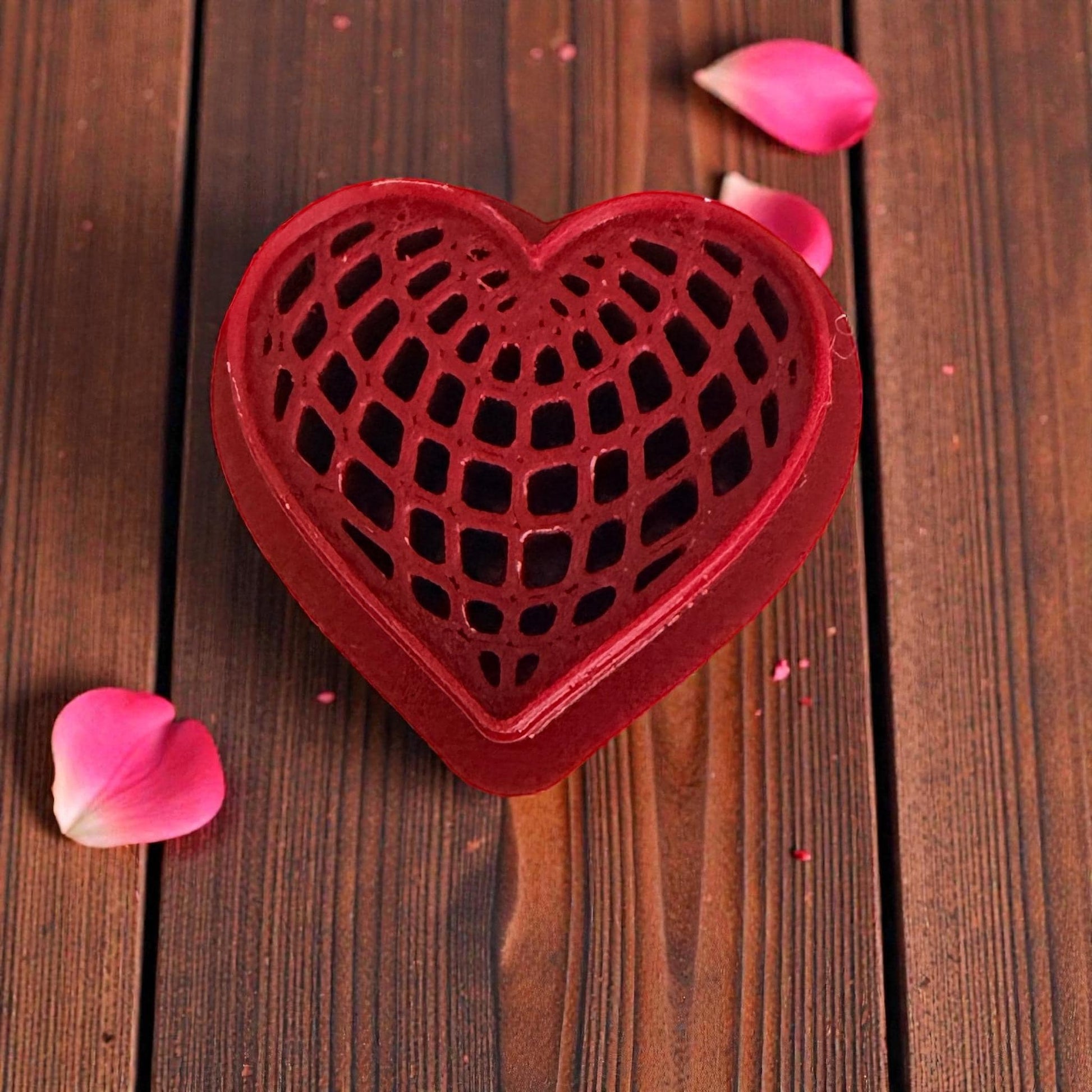 close-up red heart web texture cutter on wooden background