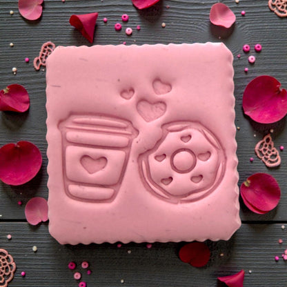Pink clay impression of donut and coffee Valentine design with sprinkles and petals