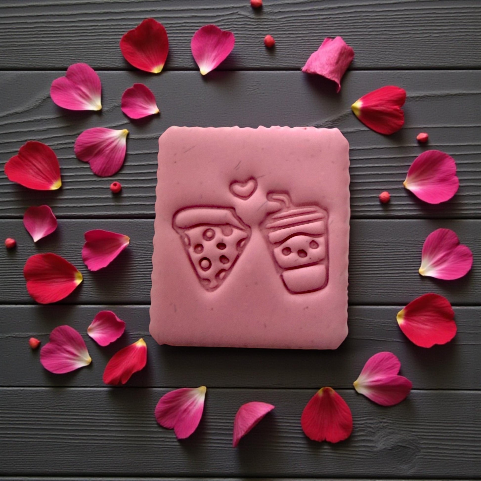 Pink up close pink slab of pizza and drink