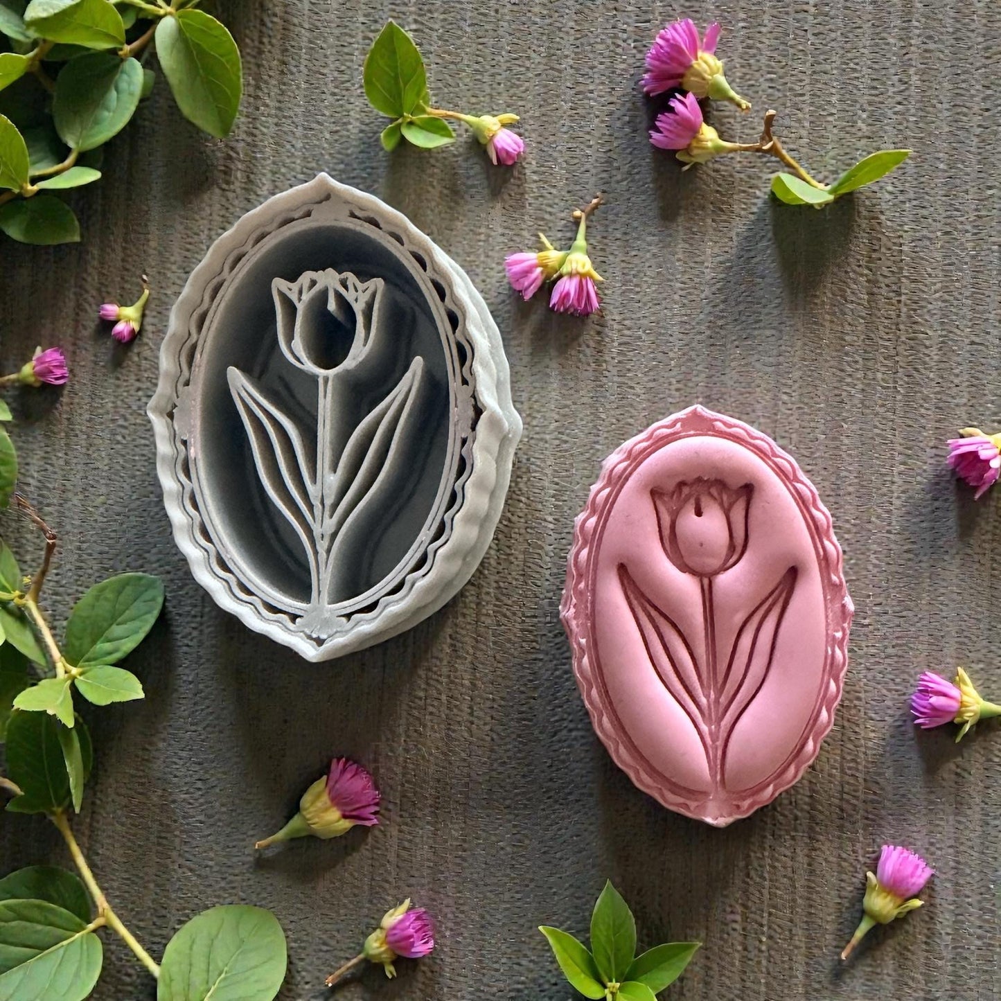 Tulip cutter and clay imprint surrounded by small flowers