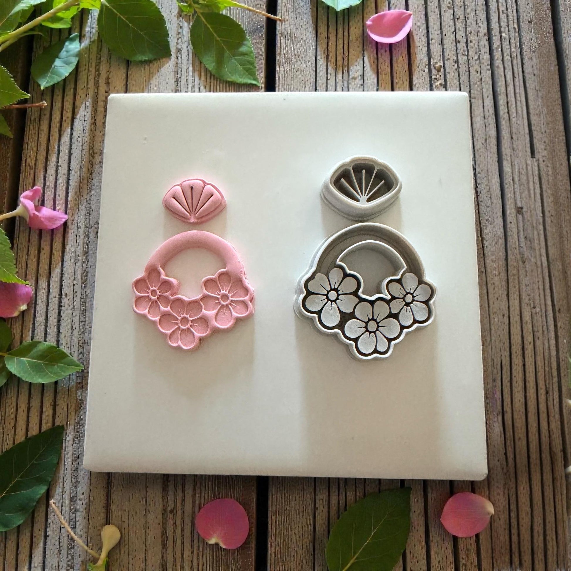 floral dangle cutter set on white tile with greenery