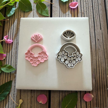 floral dangle cutter set on white tile with greenery