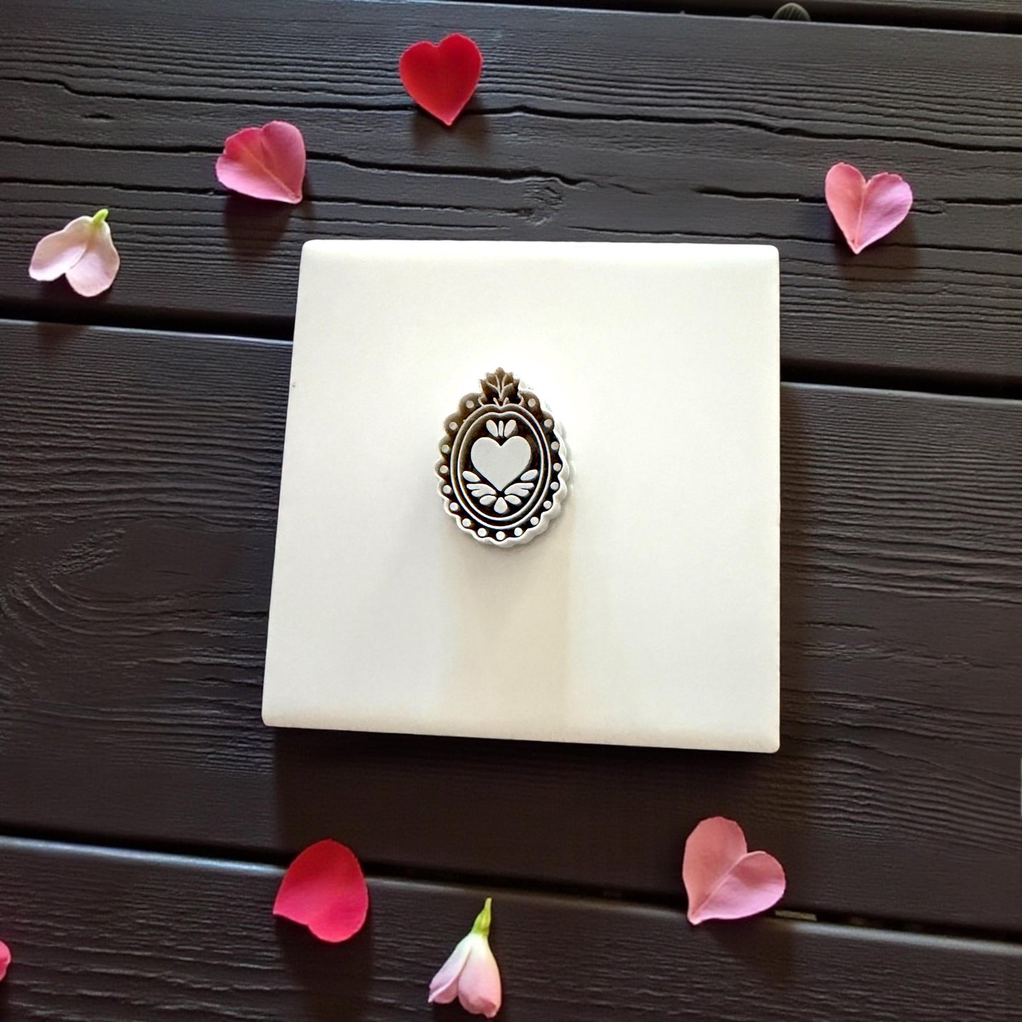 grey ornate heart-frame cutter on tile