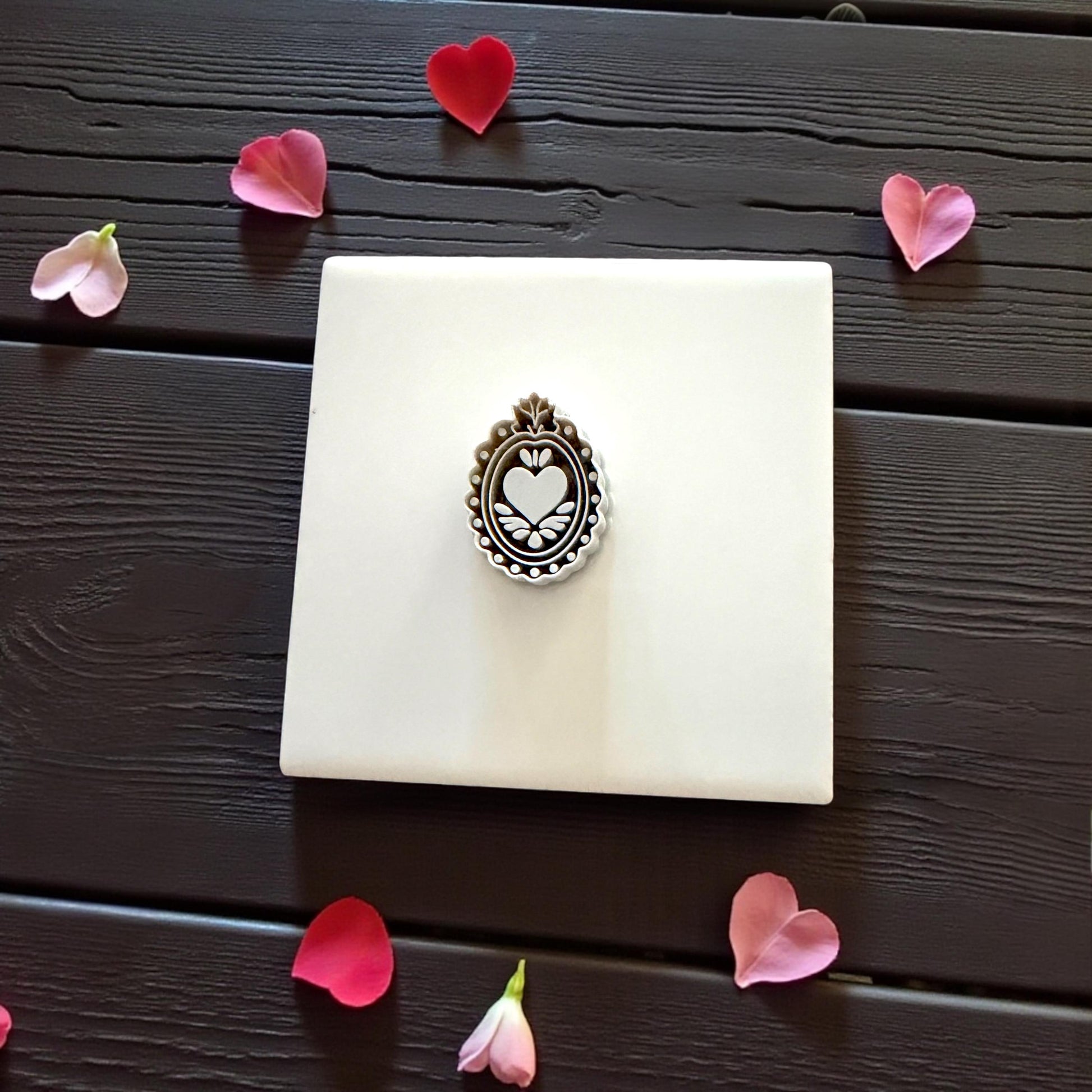 grey ornate heart-frame cutter on tile