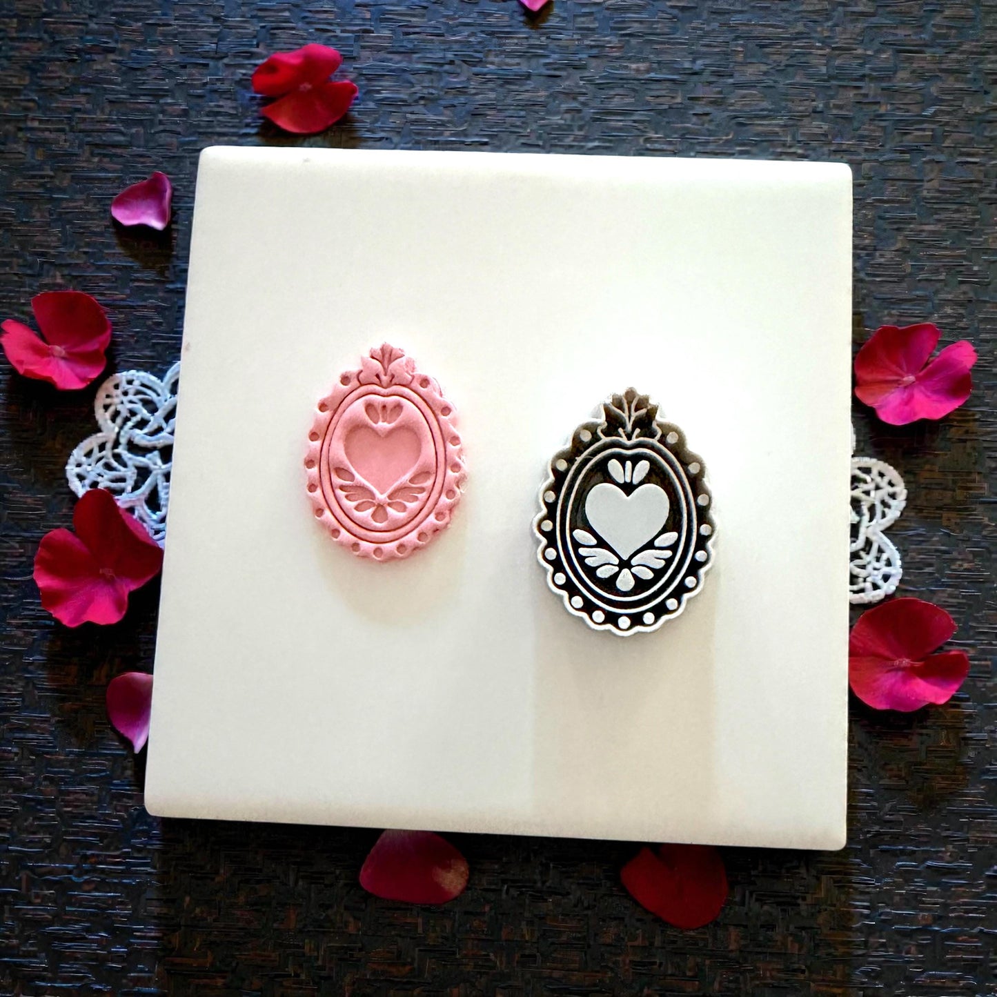 pink and gray heart-frame cutters side by side