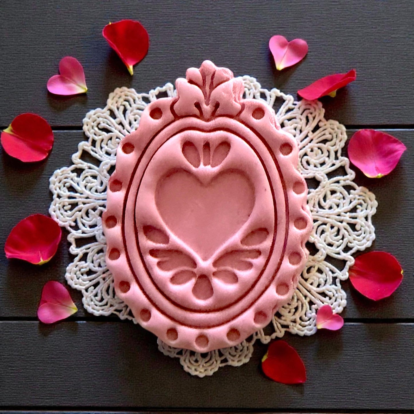 close-up pink ornate heart-frame clay imprint