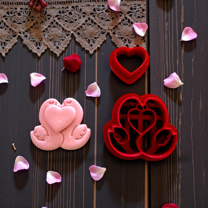 pink swan clay piece next to matching cutter set