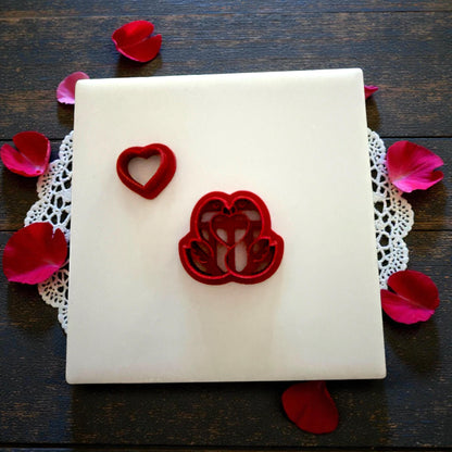 heart swan cutter and heart mold on tile with petals