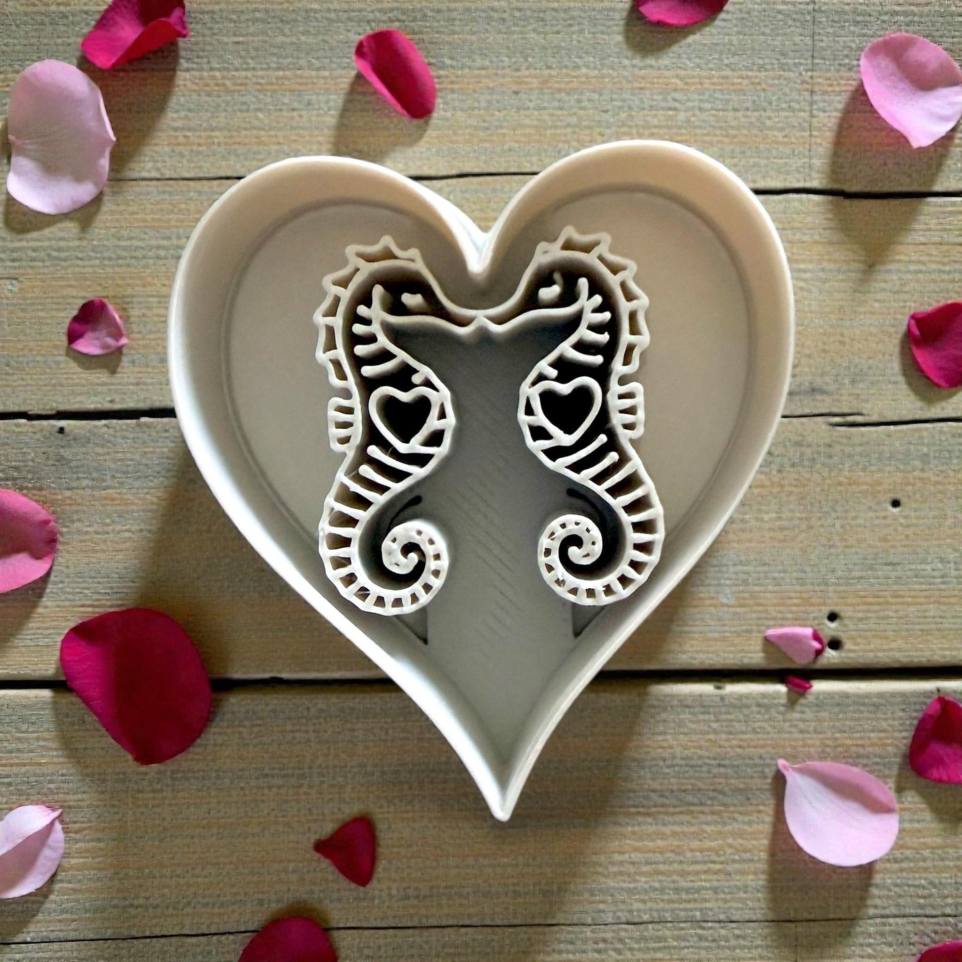 closeup of white seahorse heart cutter inside heart frame