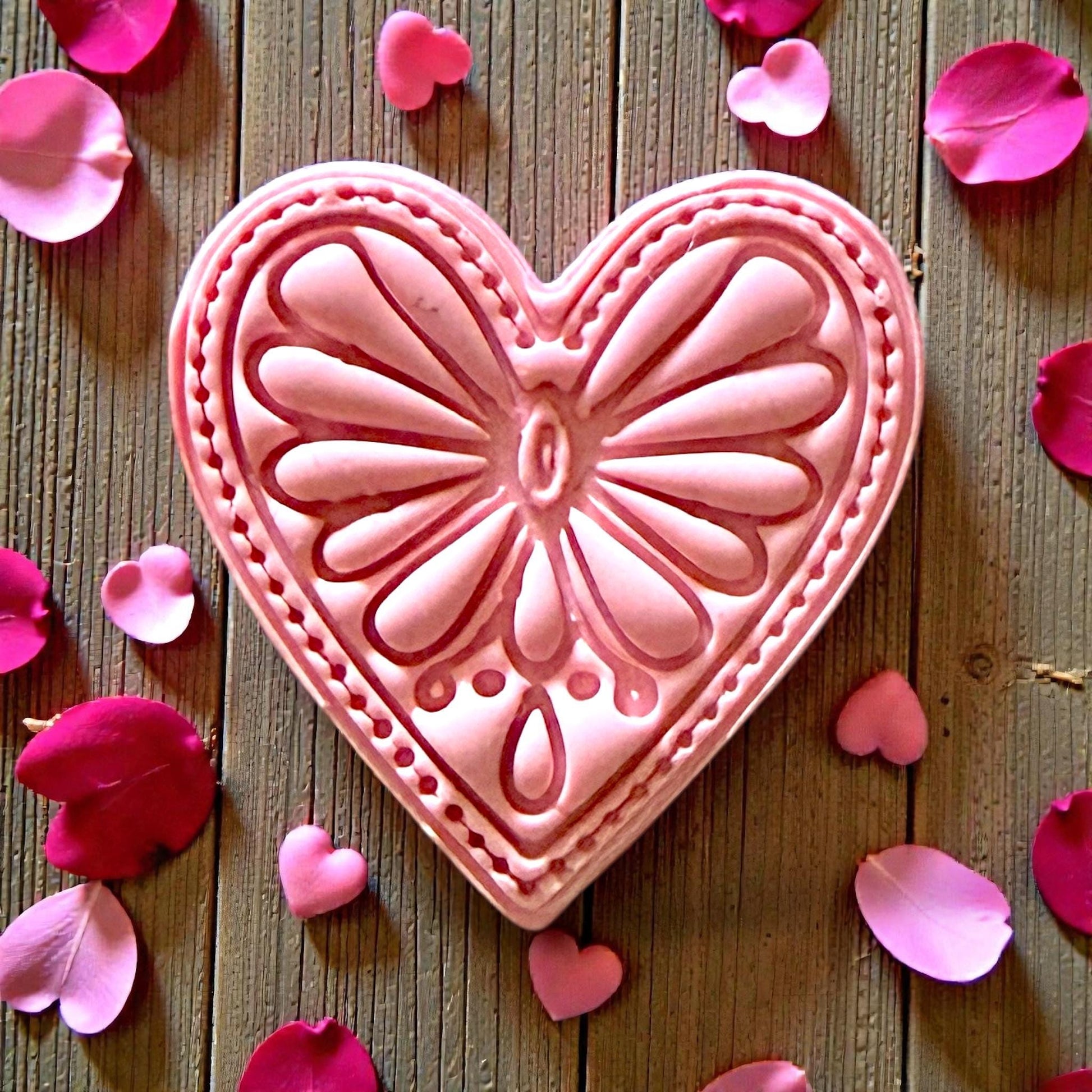 Closeup of large pink boho heart impression with floral details