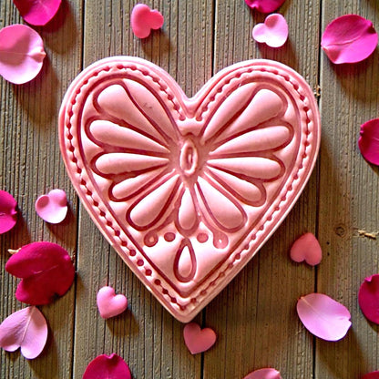 Closeup of large pink boho heart impression with floral details