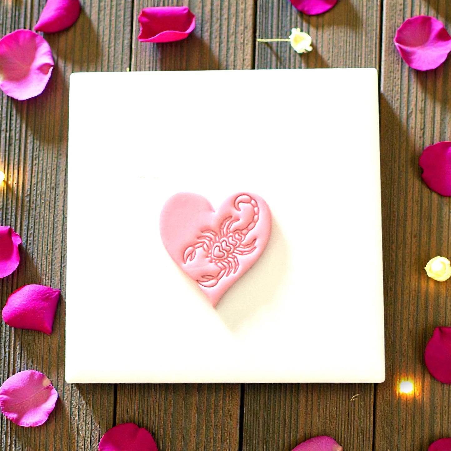 pink clay heart with scorpion detail