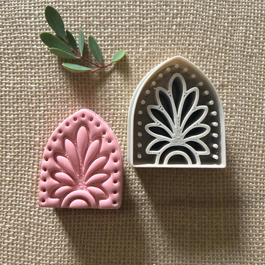 pink clay impression next to the boho arch cutter
