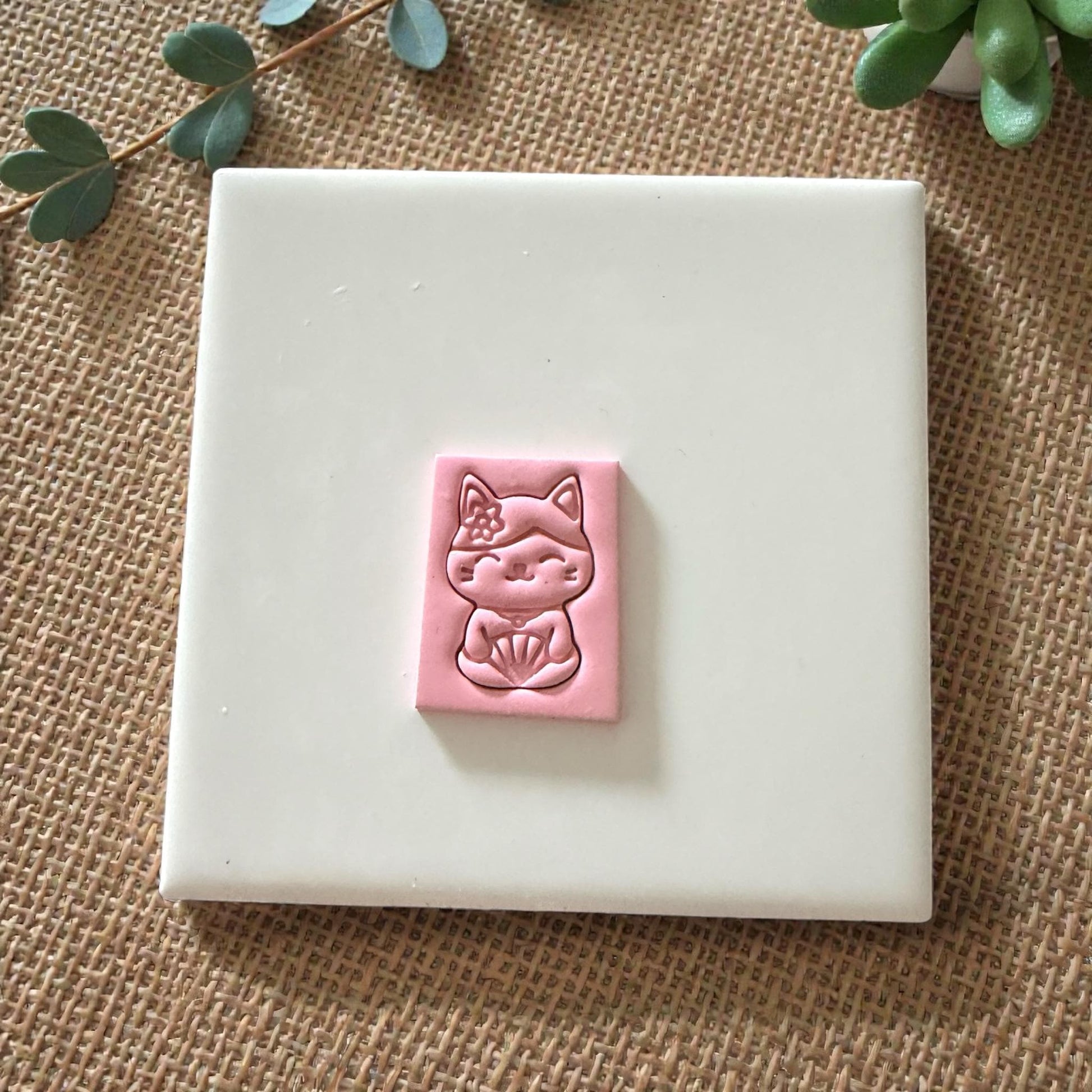 rectangular pink clay slab with kawaii cat design