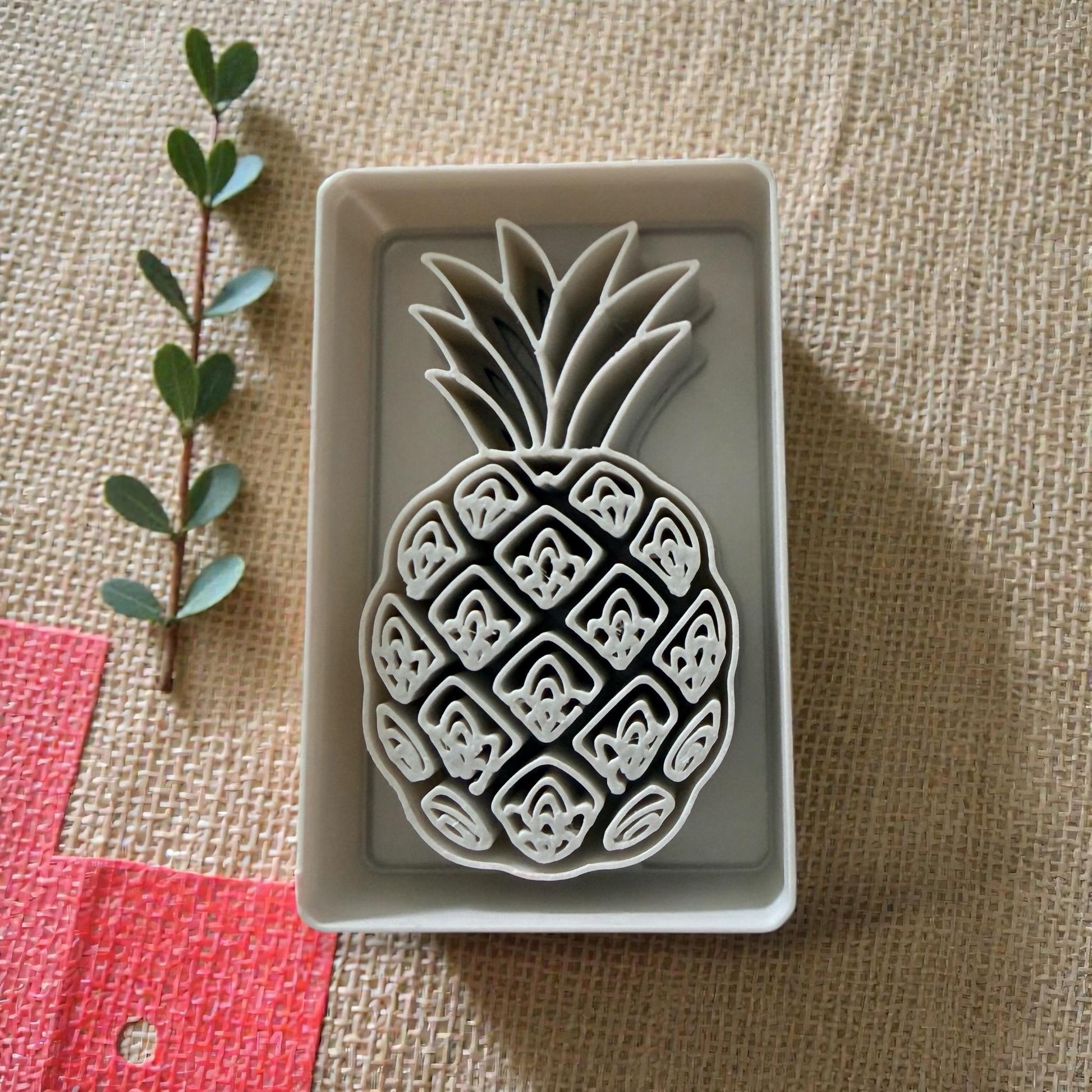 close up pineapple clay cutter in tray