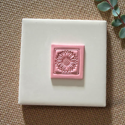 square sunflower clay impression with double border on tile