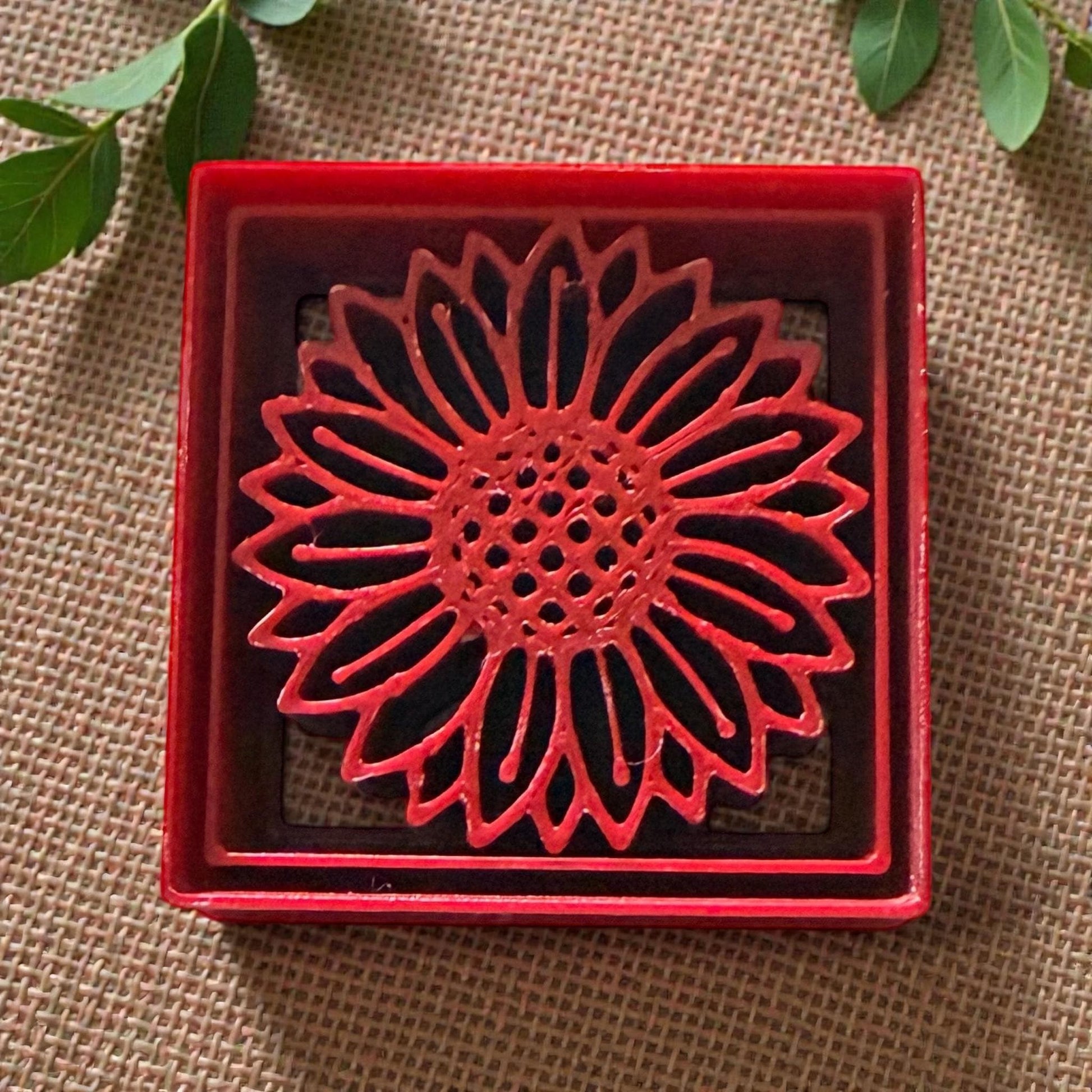 sunflower square polymer clay cutter in red frame on textured background