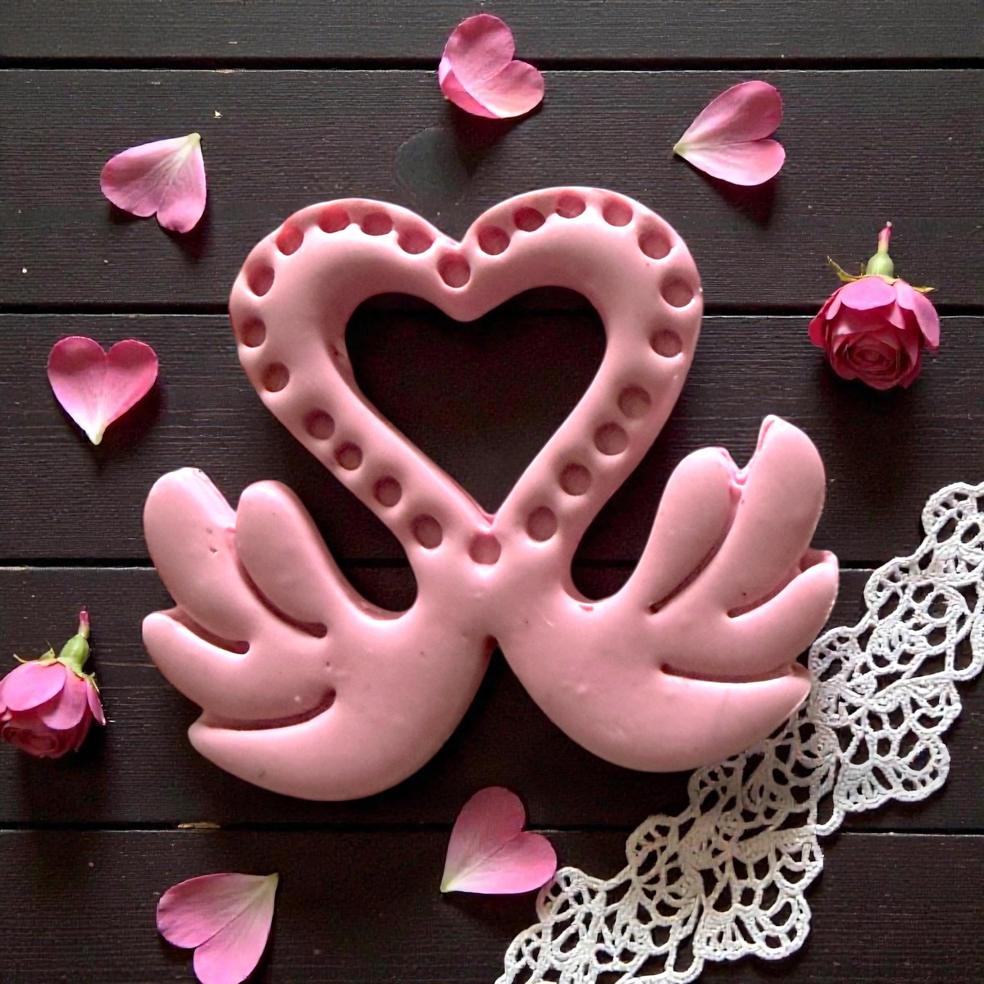 pink clay impression of love swan design