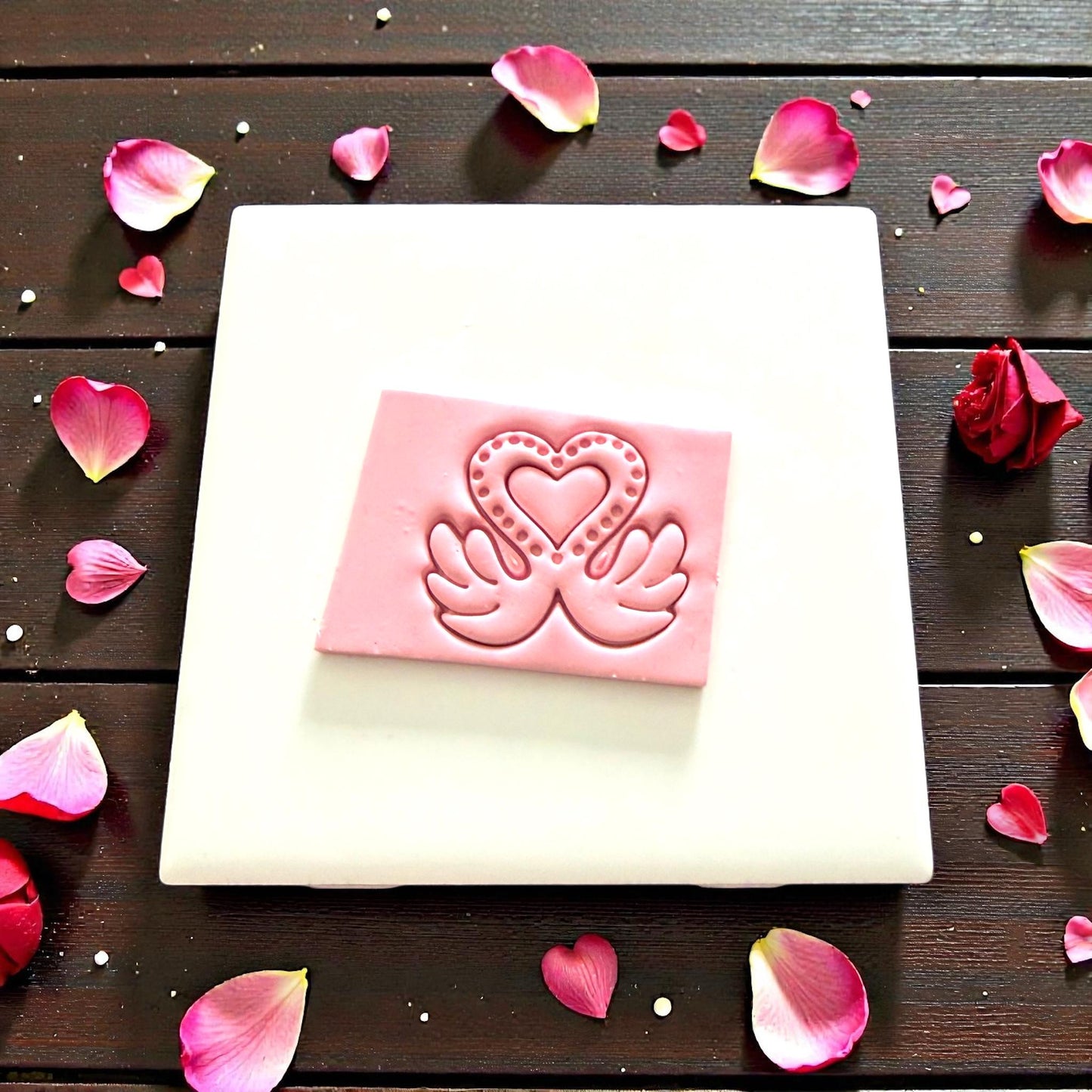pink clay impression of love swan design