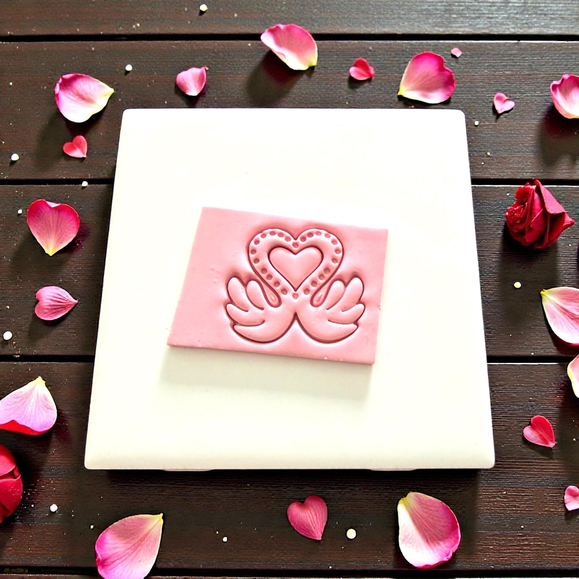 pink clay impression of love swan design