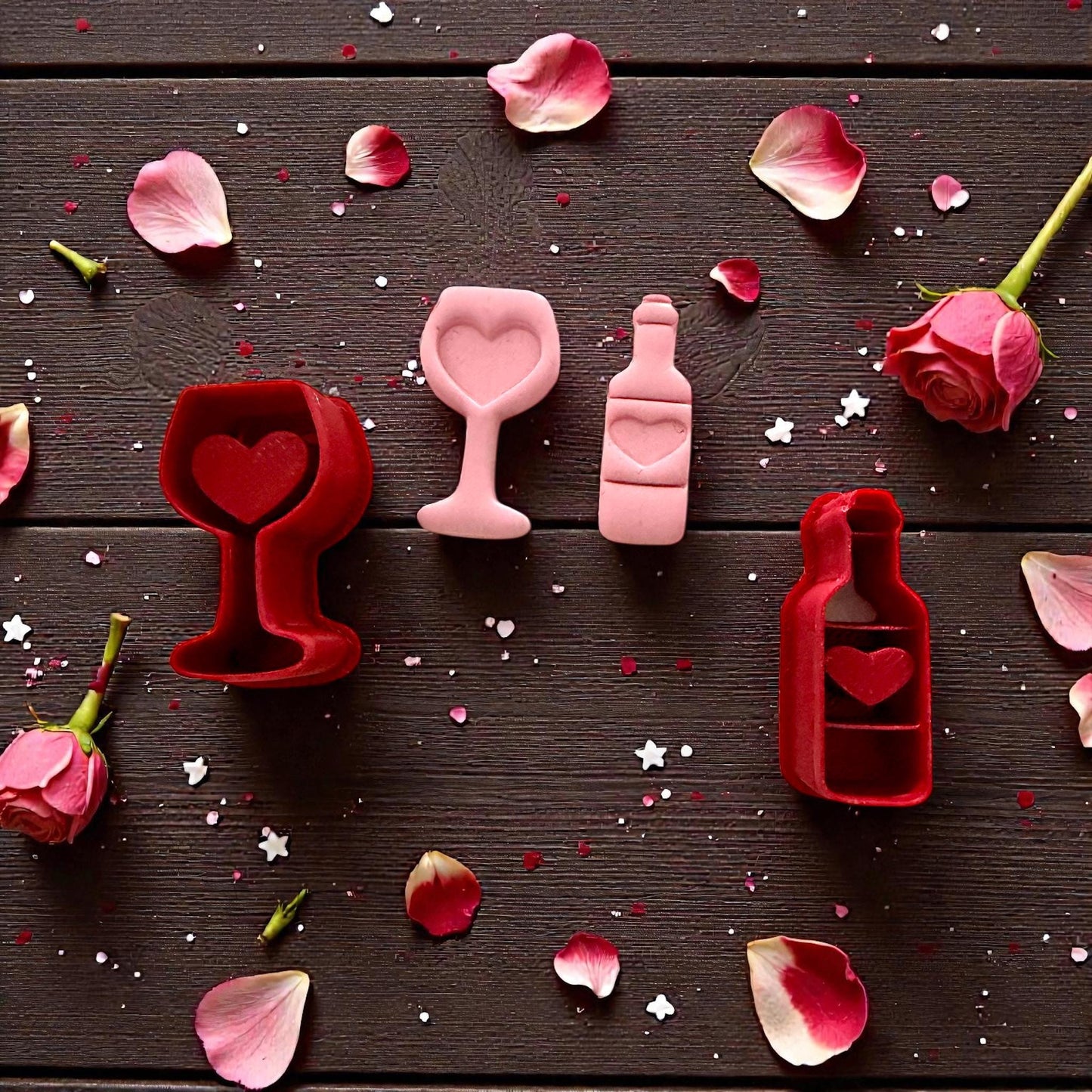 Wine glass and bottle cutter set with petals and roses on dark background