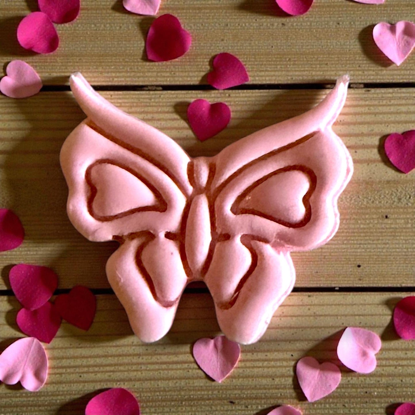 close up pink butterfly clay impression