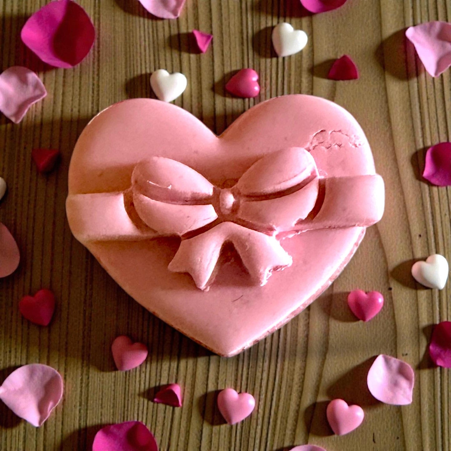 close up heart gift box clay piece with bow