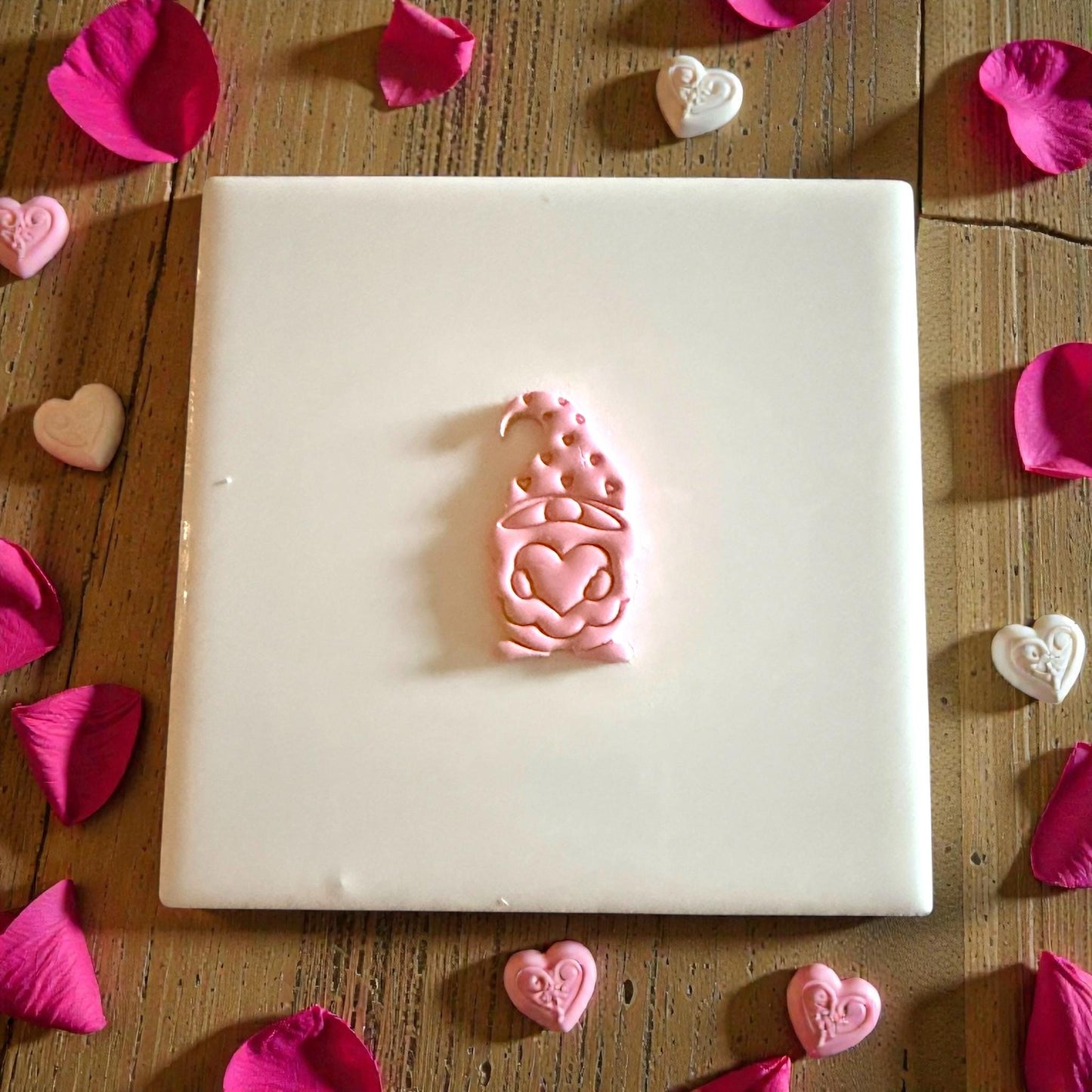 Valentine gnome clay imprint centered on tile