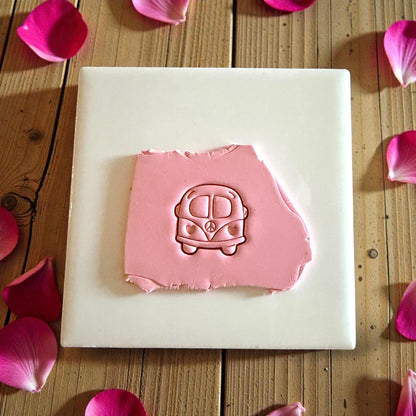 love bus clay impression on pink clay slab