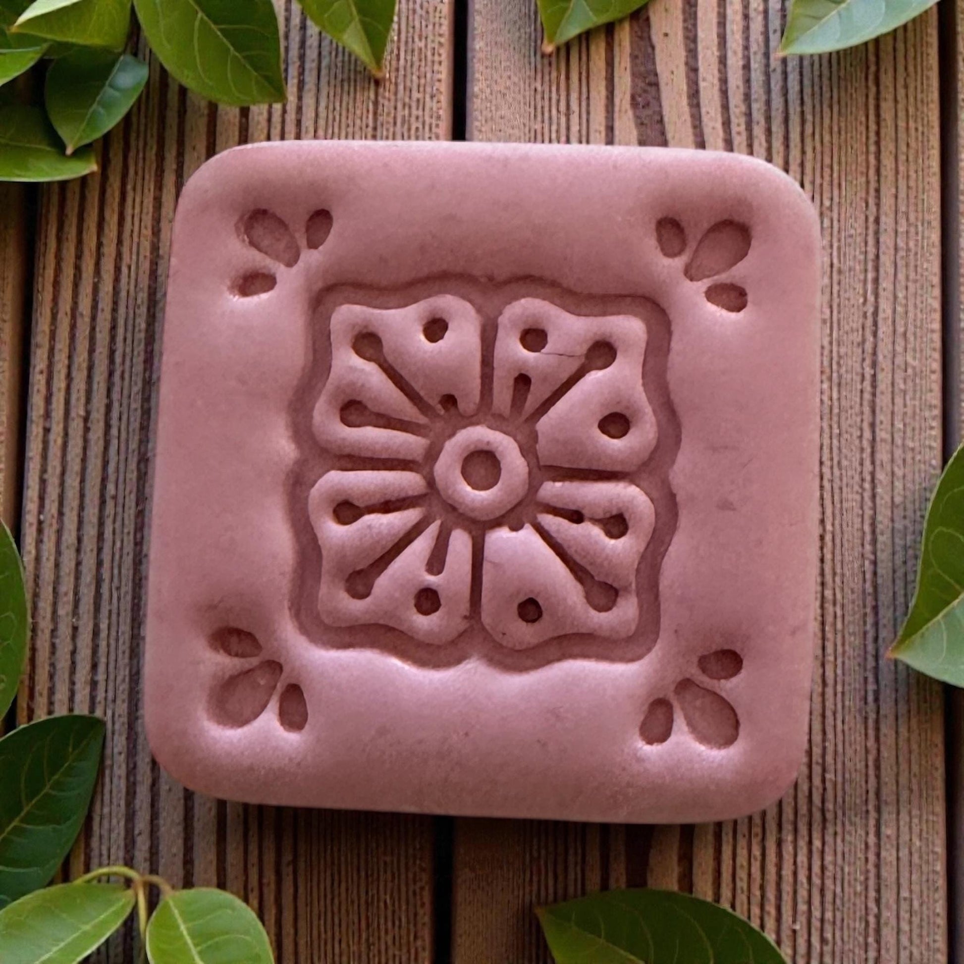 small square tile cutter displayed on white board