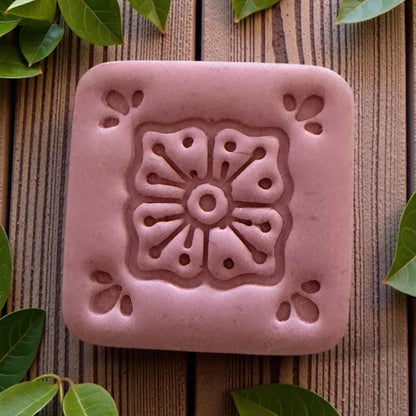 small square tile cutter displayed on white board