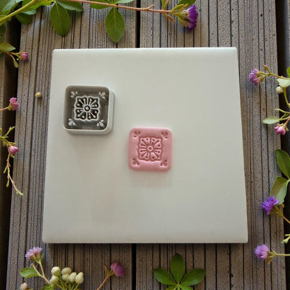 gray and pink floral tile clay impressions side by side