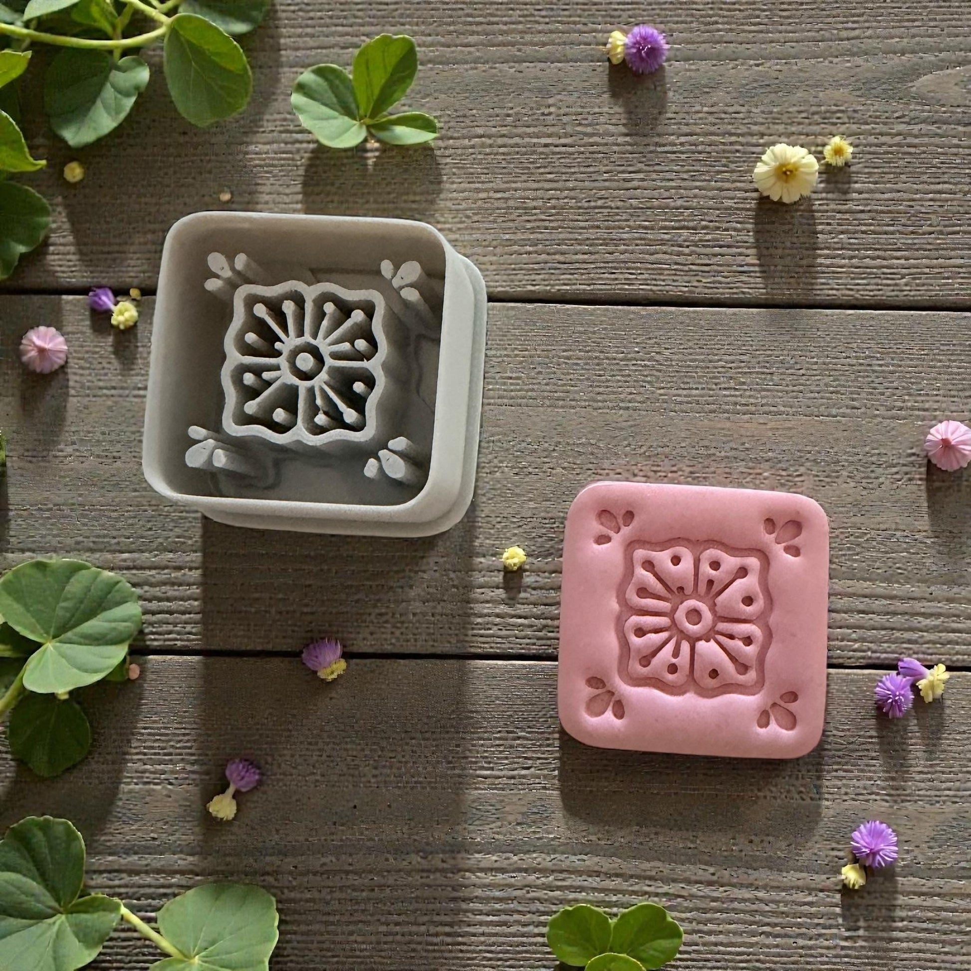 gray and pink floral tile clay impressions side by side