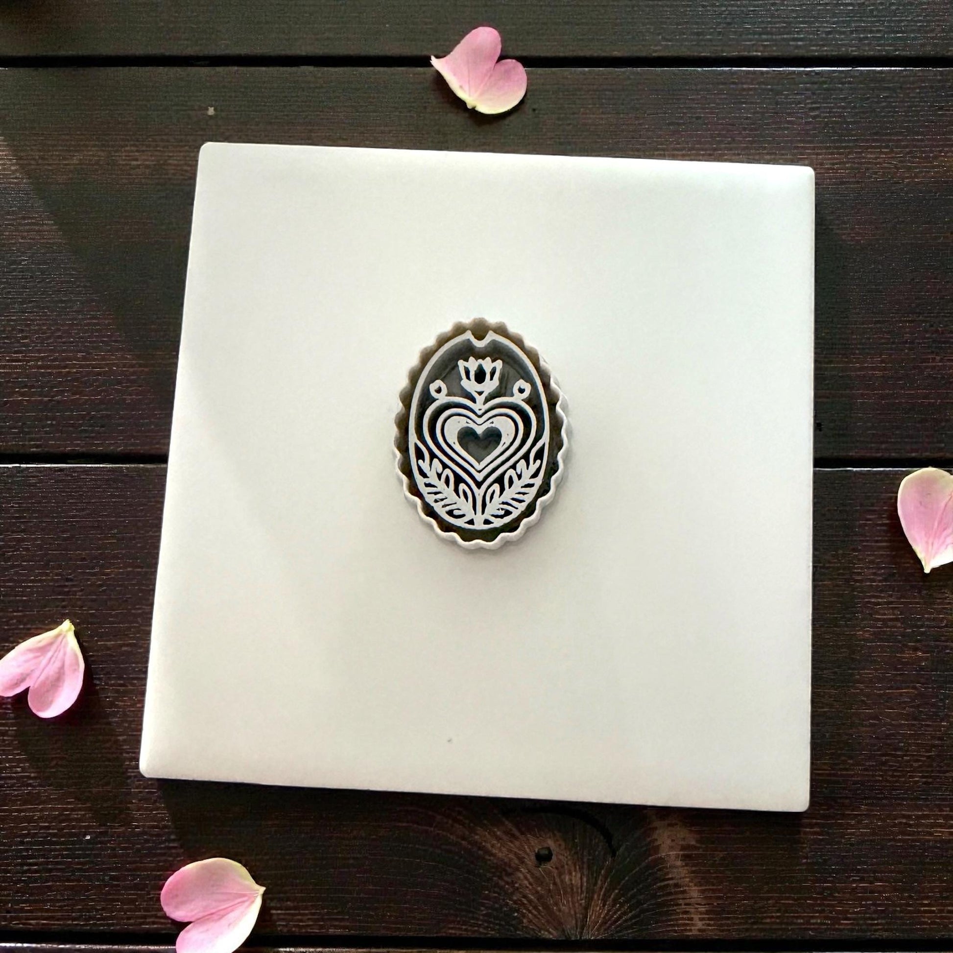 grey folk heart cutter centered on tile