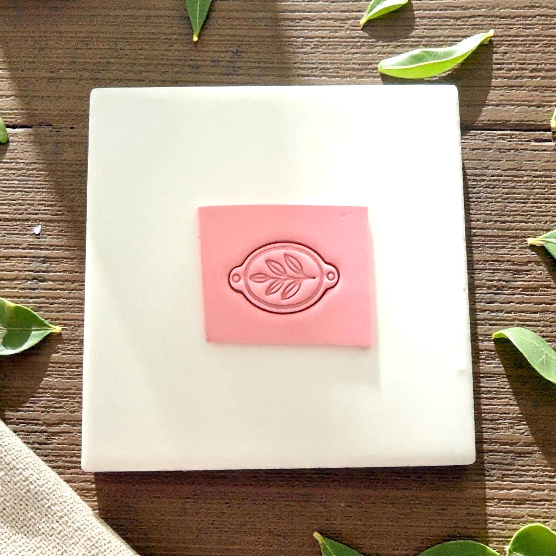 clay slab stamped with leaf bracelet connector cutter