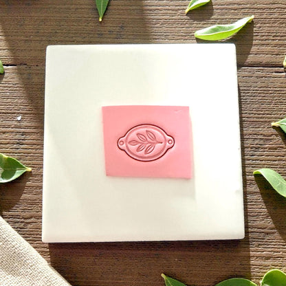 clay slab stamped with leaf bracelet connector cutter