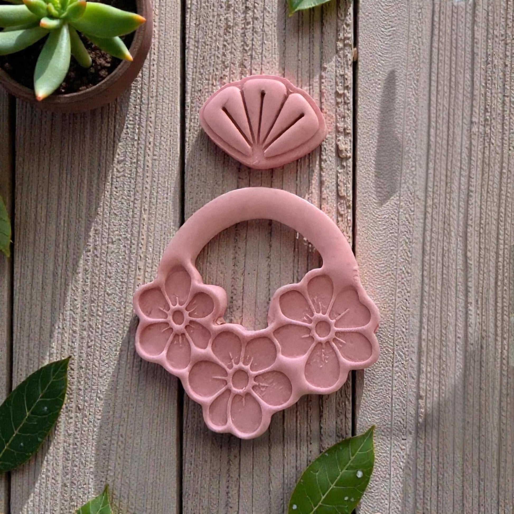 pink clay floral dangle impression close up