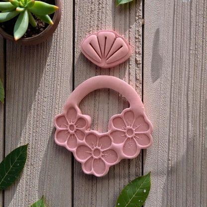 pink clay floral dangle impression close up