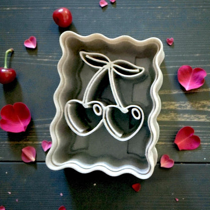close up of cherry cutter on tile with rose petals