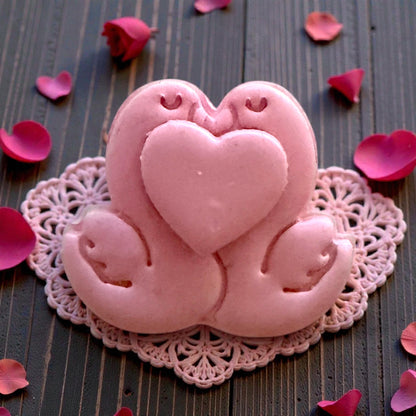 pink heart swan clay piece close-up