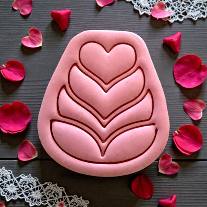 close up pink heart petal folk flower clay piece