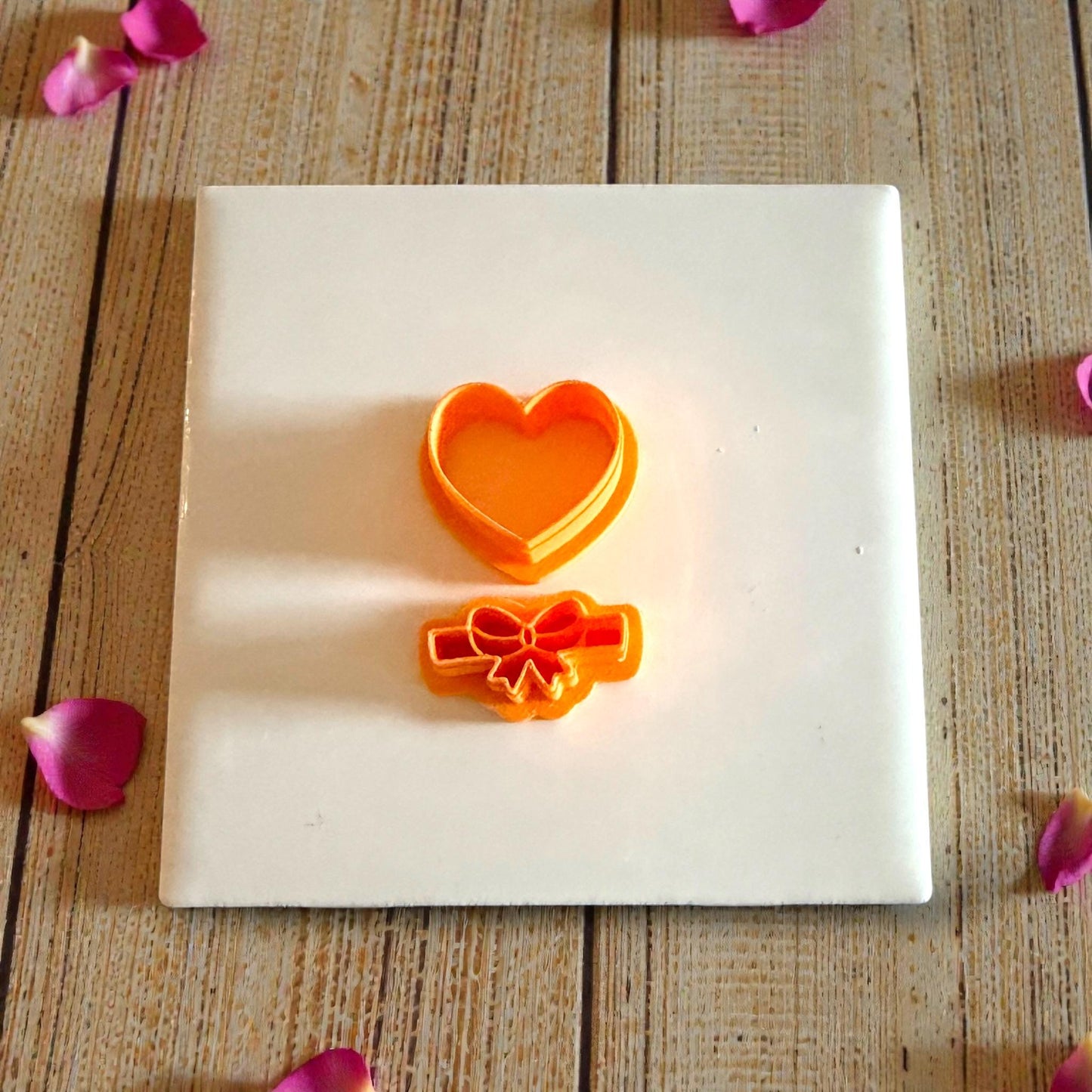 heart and bow cutters shown on tile