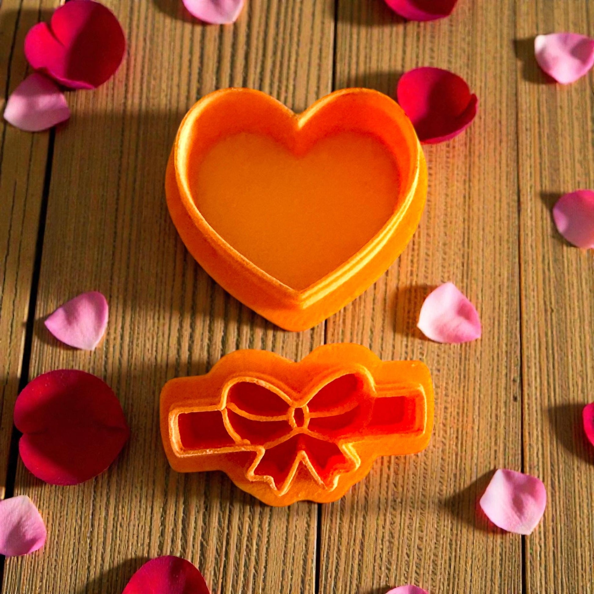 close up orange heart and bow cutters