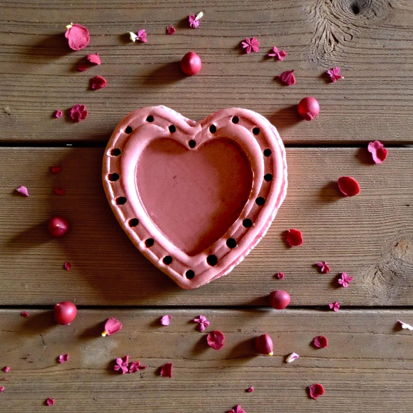 large pink dotted heart clay piece with border dots