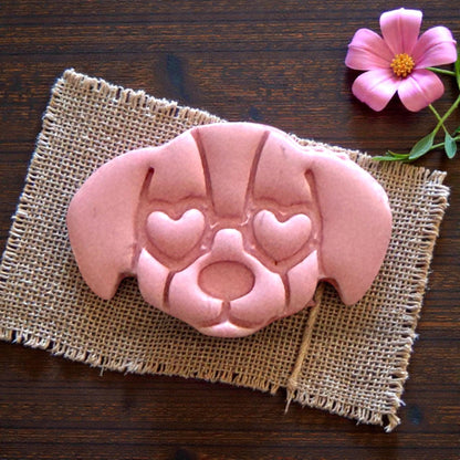 large puppy face clay impression on burlap