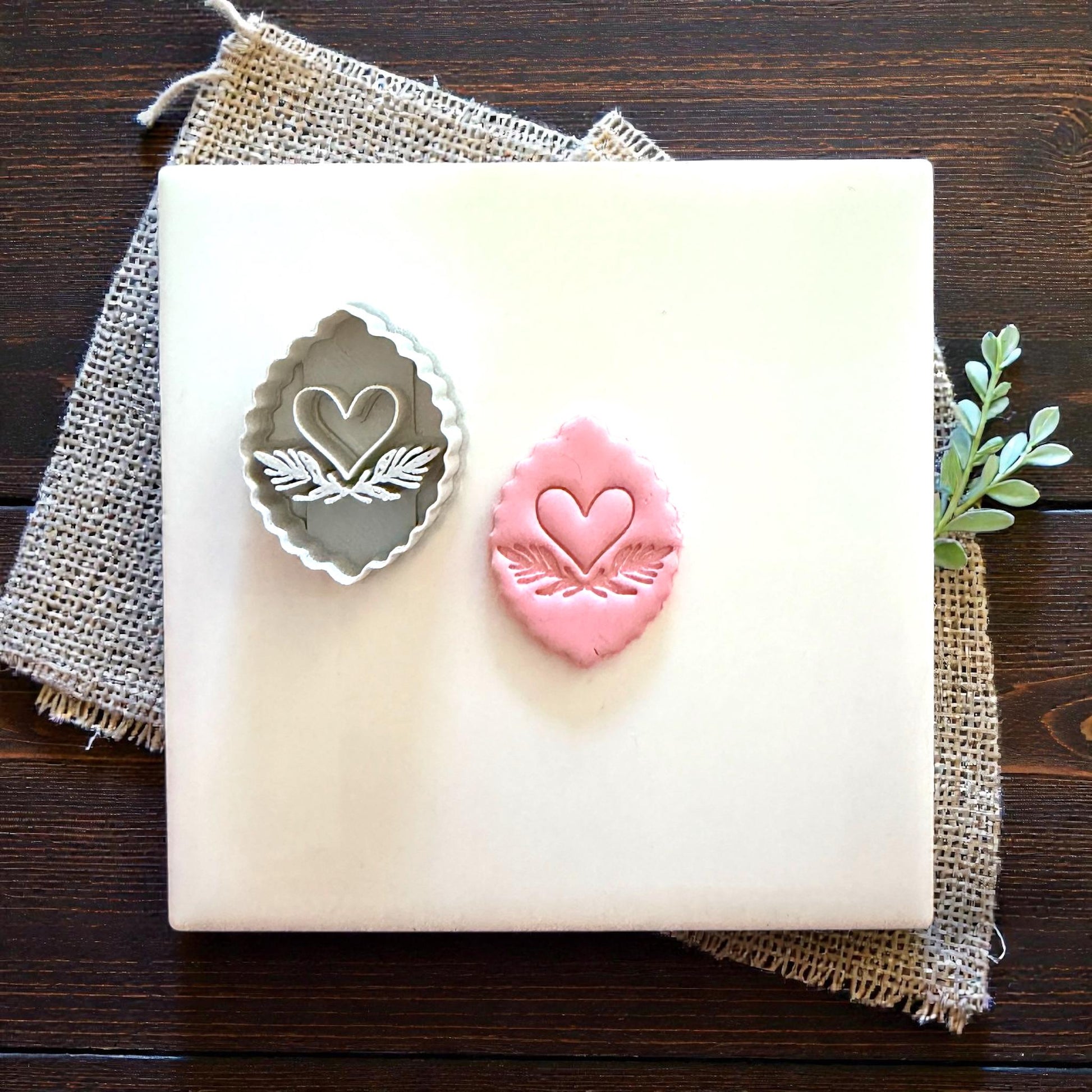 scalloped heart cutter and clay piece on tile