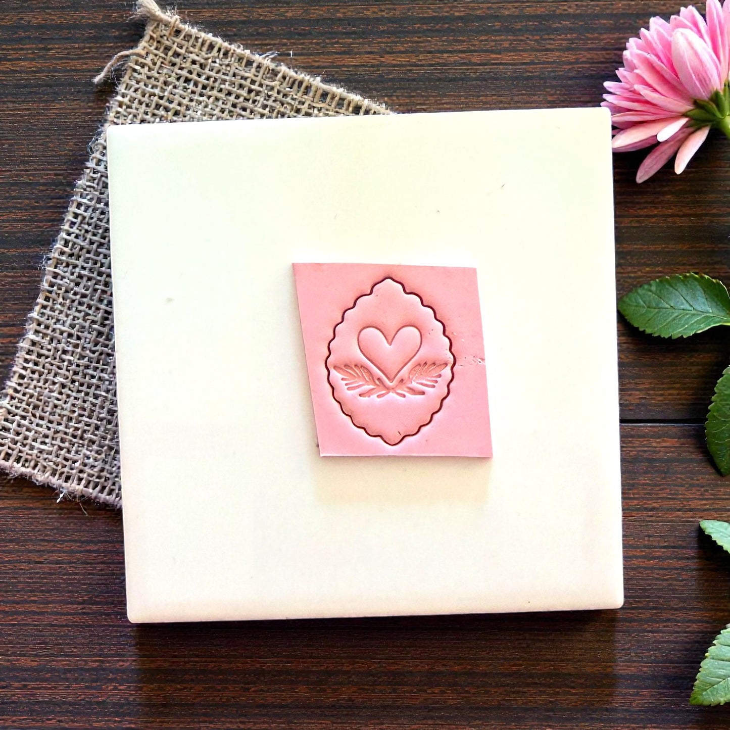 scalloped heart clay imprint on tile