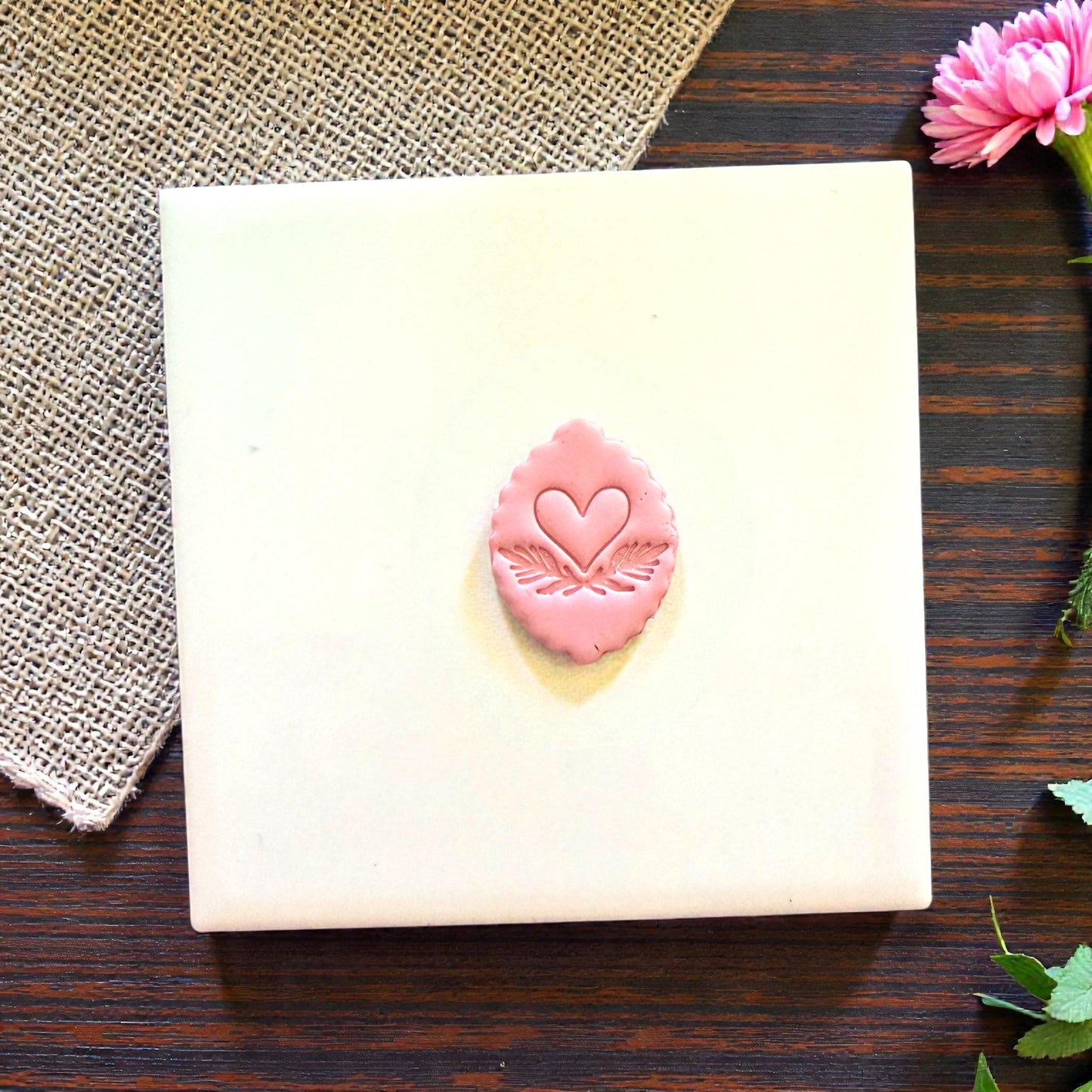 small heart leaf clay shape on tile