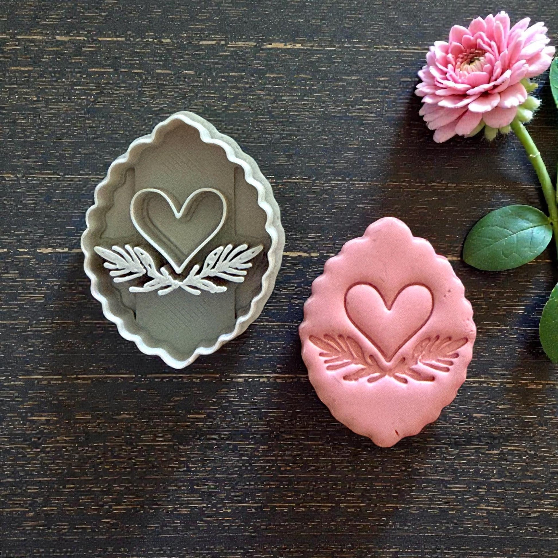 clay cutter and heart imprint side by side