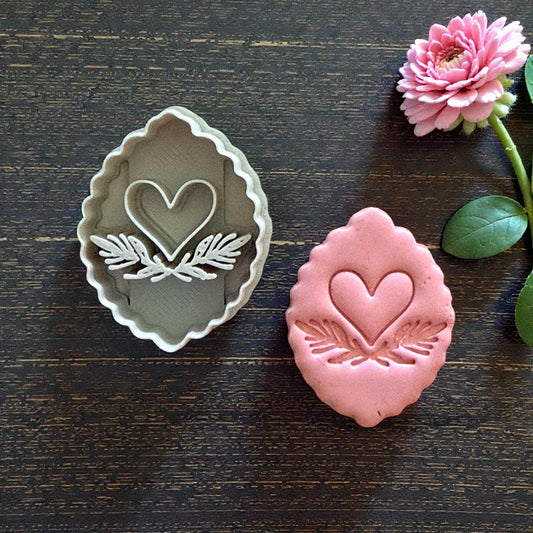 clay cutter and heart imprint side by side